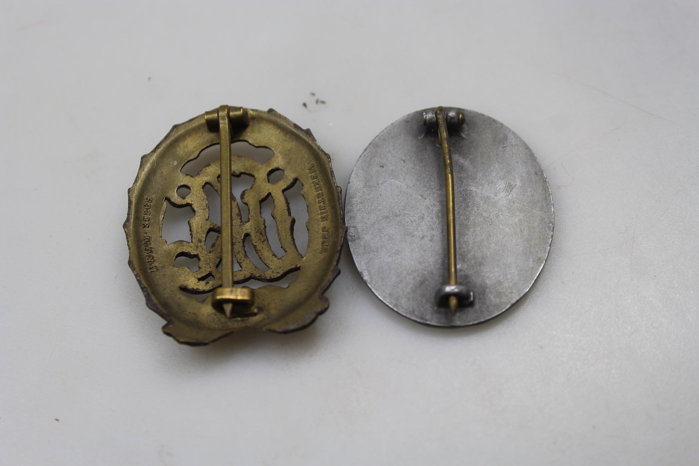 Distintivi DRL "Bronzo" e Ferita "silver" denazificati