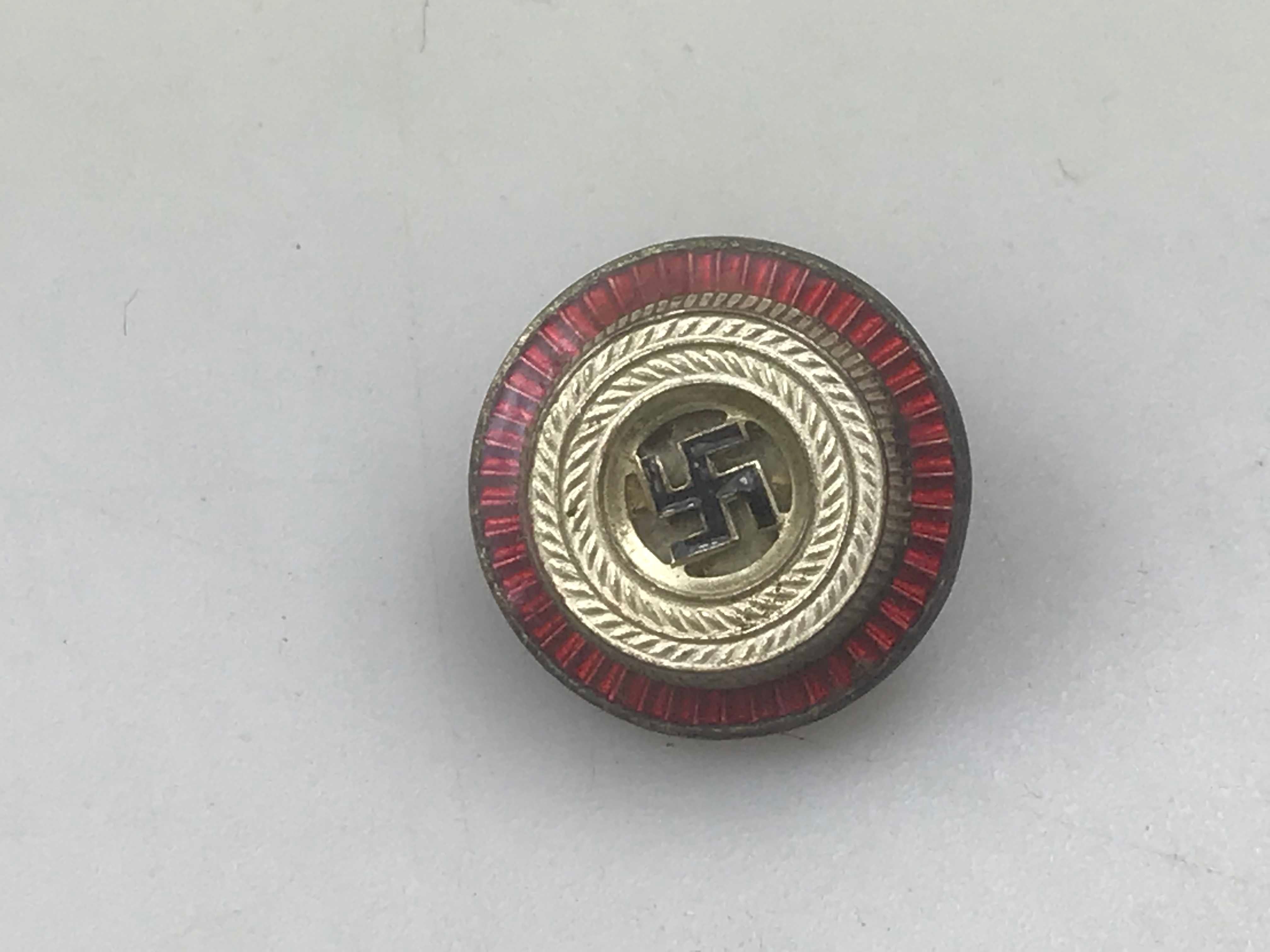 Coccarda smaltata Schirmmutze NSDAP,